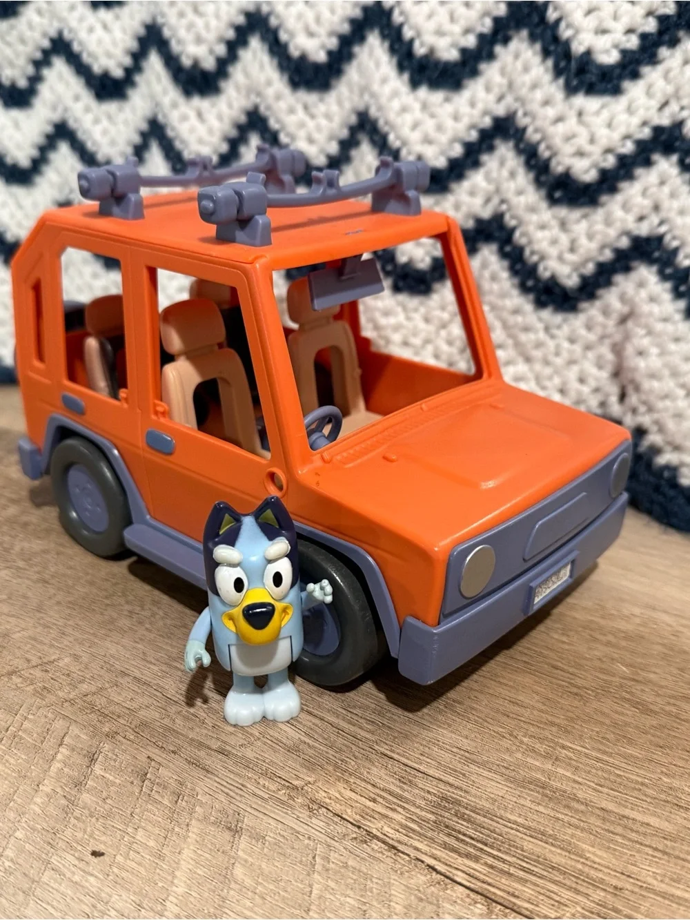 Orange Toy SUV Play Vehicle with Light Blue Figurine